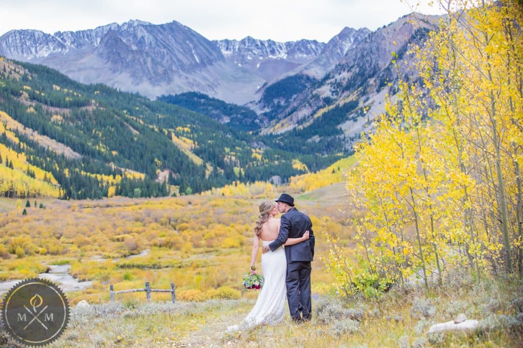 Aspen Colorado wedding couple with Elk Mountain and aspen grove backdrop