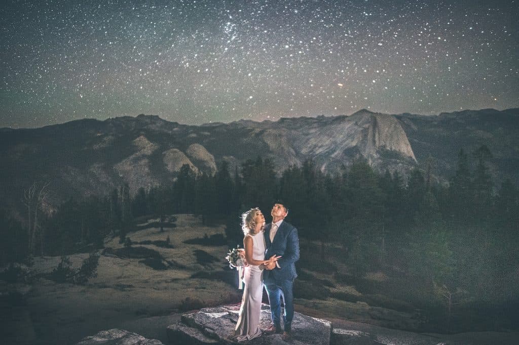 Glacier Point Yosemite elopement couple with panoramic high sierra backdrop