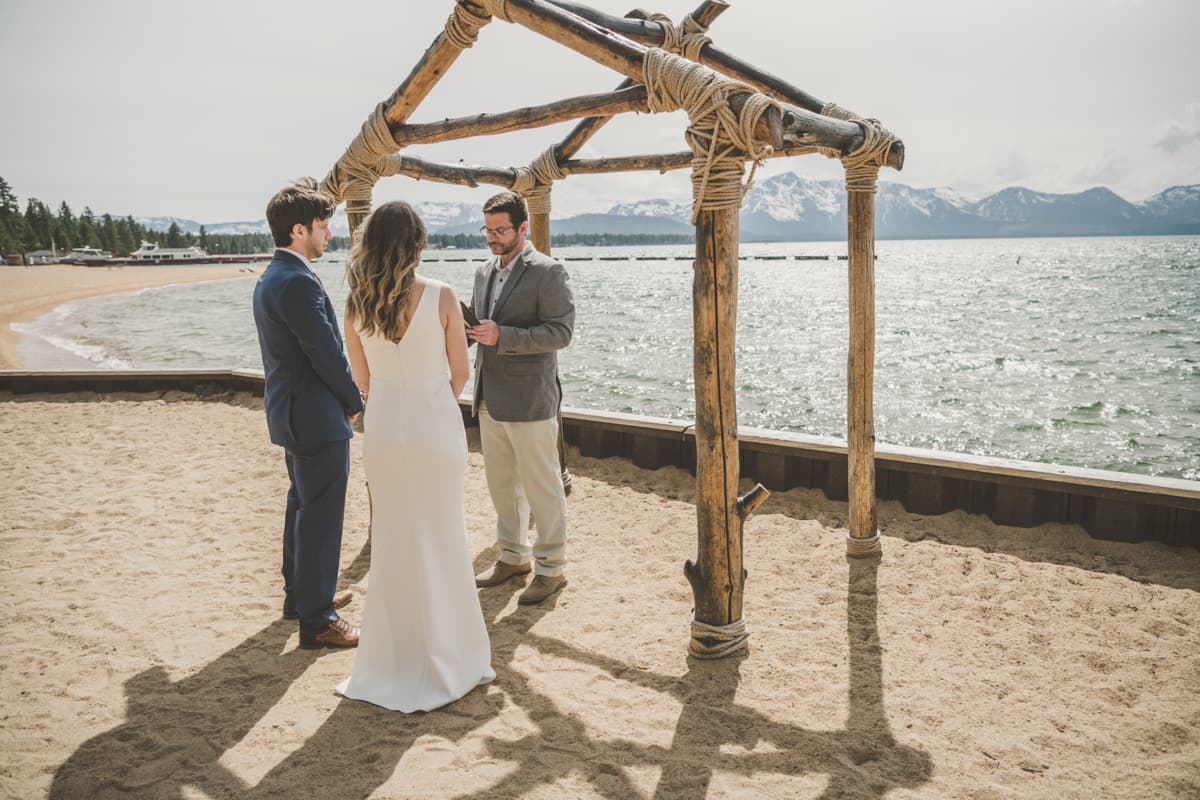 Lake Tahoe elopement couple at lakeside ceremony