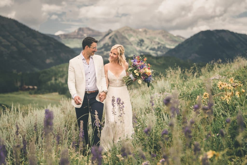 Crested Butte couple hiking at golden hour with Elk Mountain backdrop