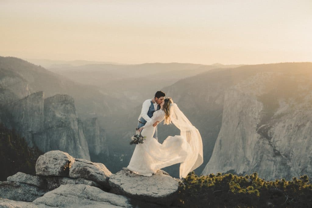 Tenaya Lodge Yosemite wedding couple with mountain and forest backdrop