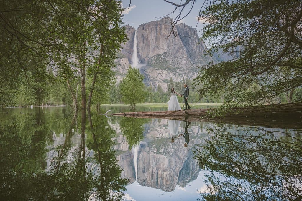 Yosemite elopement couple at dawn with valley fog and granite cliffs