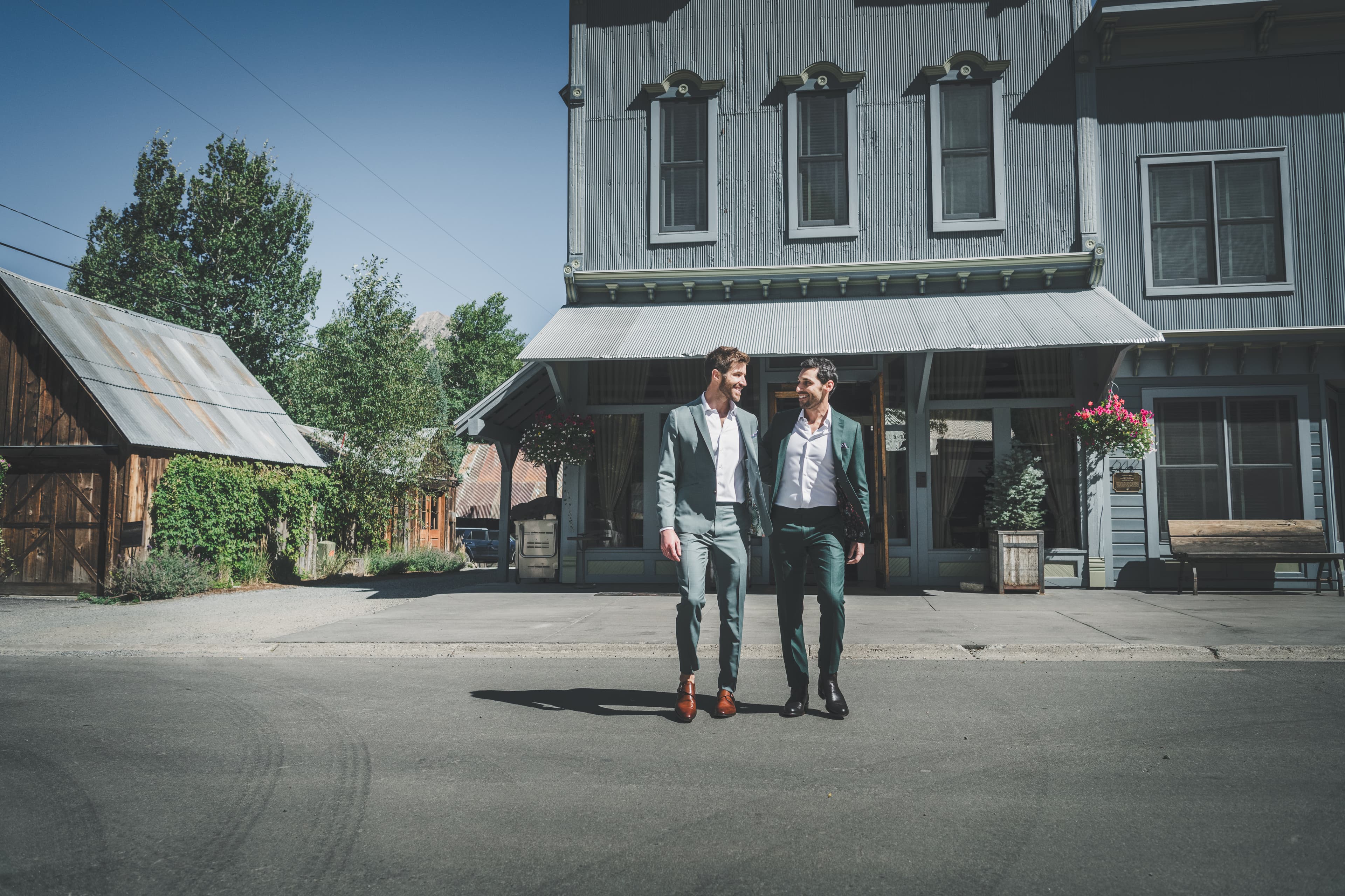 Greg and John walking down Elk Avenue in historic downtown Crested Butte before their wedding