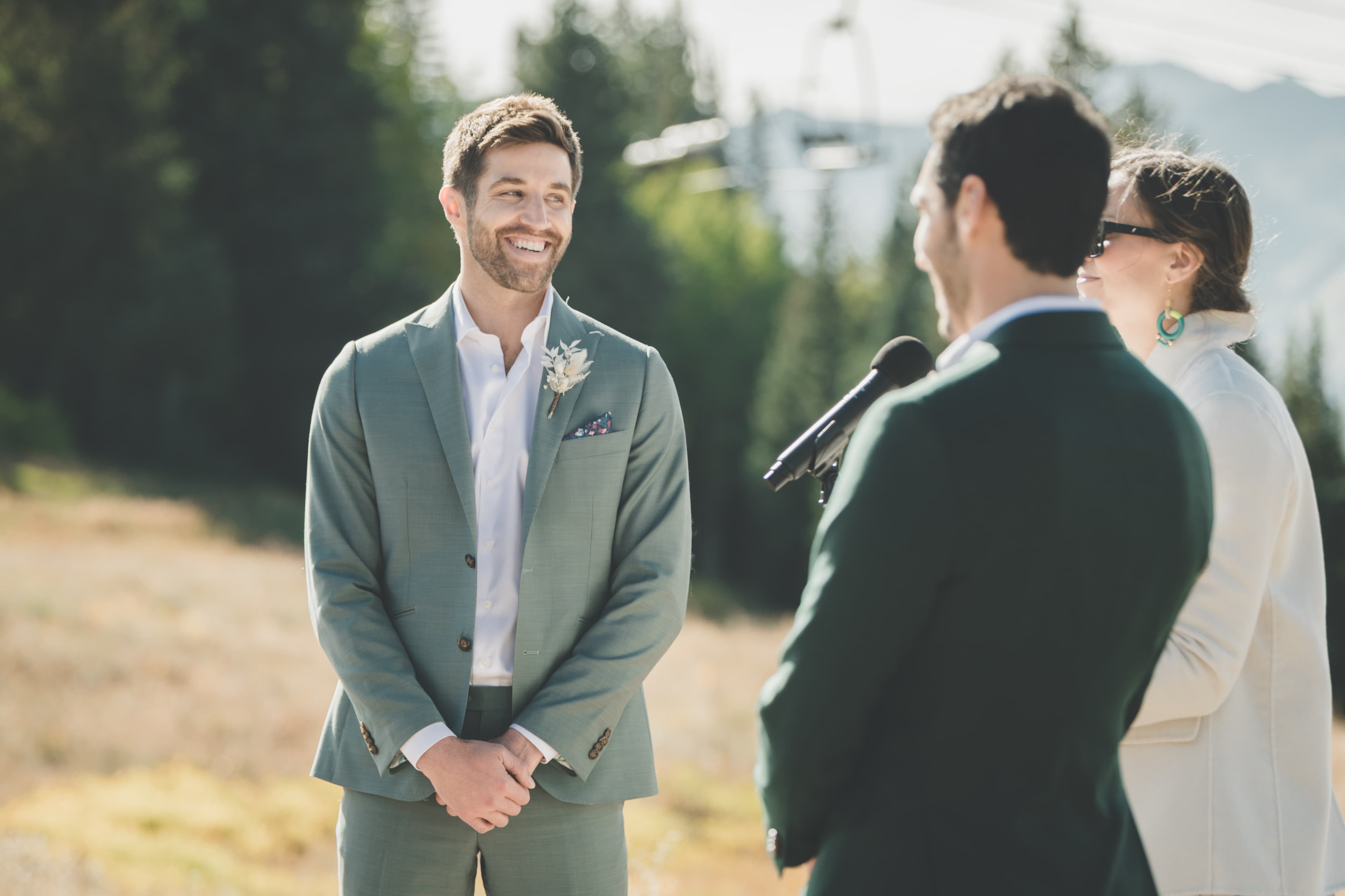 Greg watches John during their ceremony vows at Ten Peaks Lodge