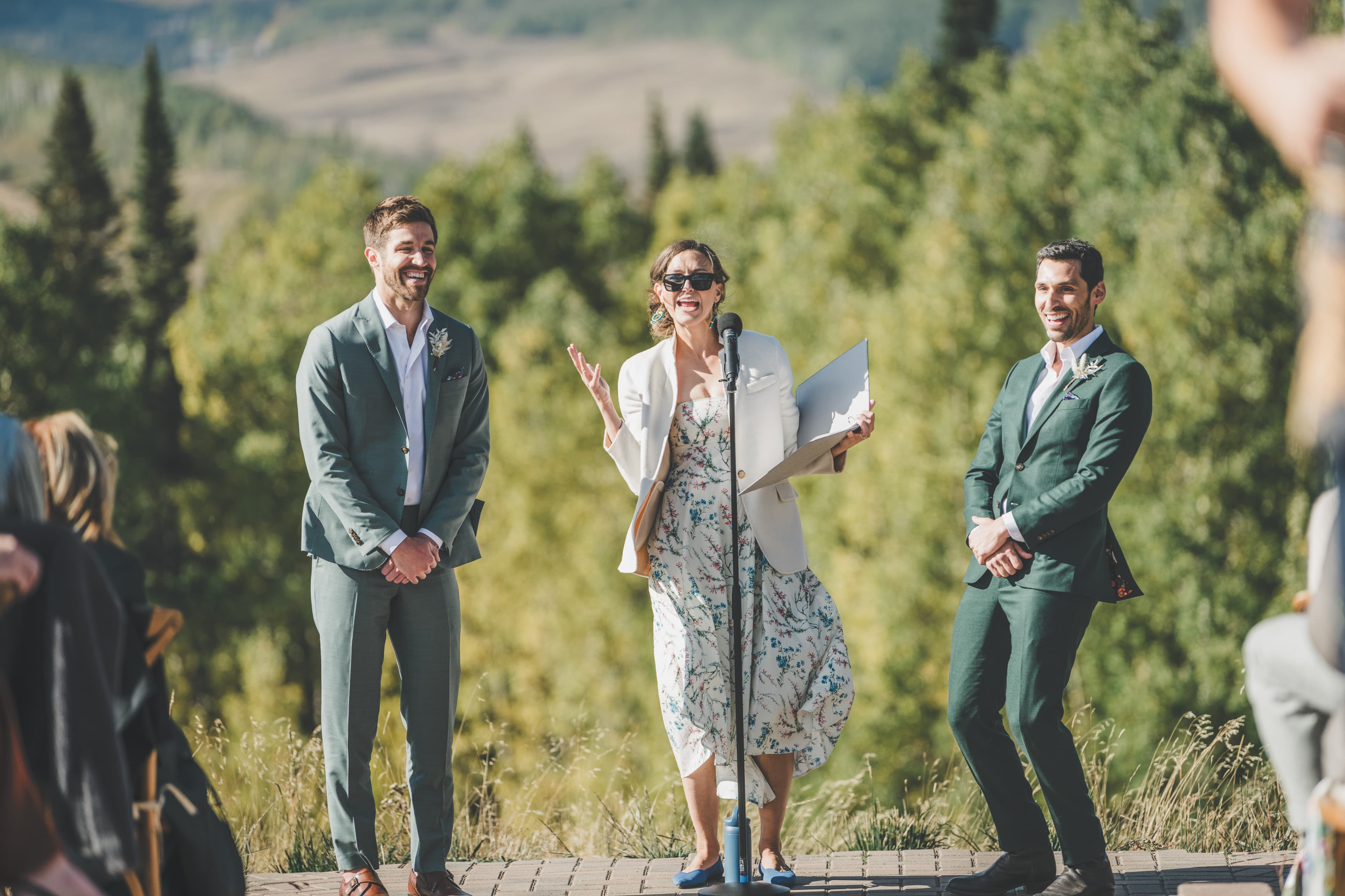 Officiant speaks during Greg and John's wedding ceremony at Ten Peaks Lodge