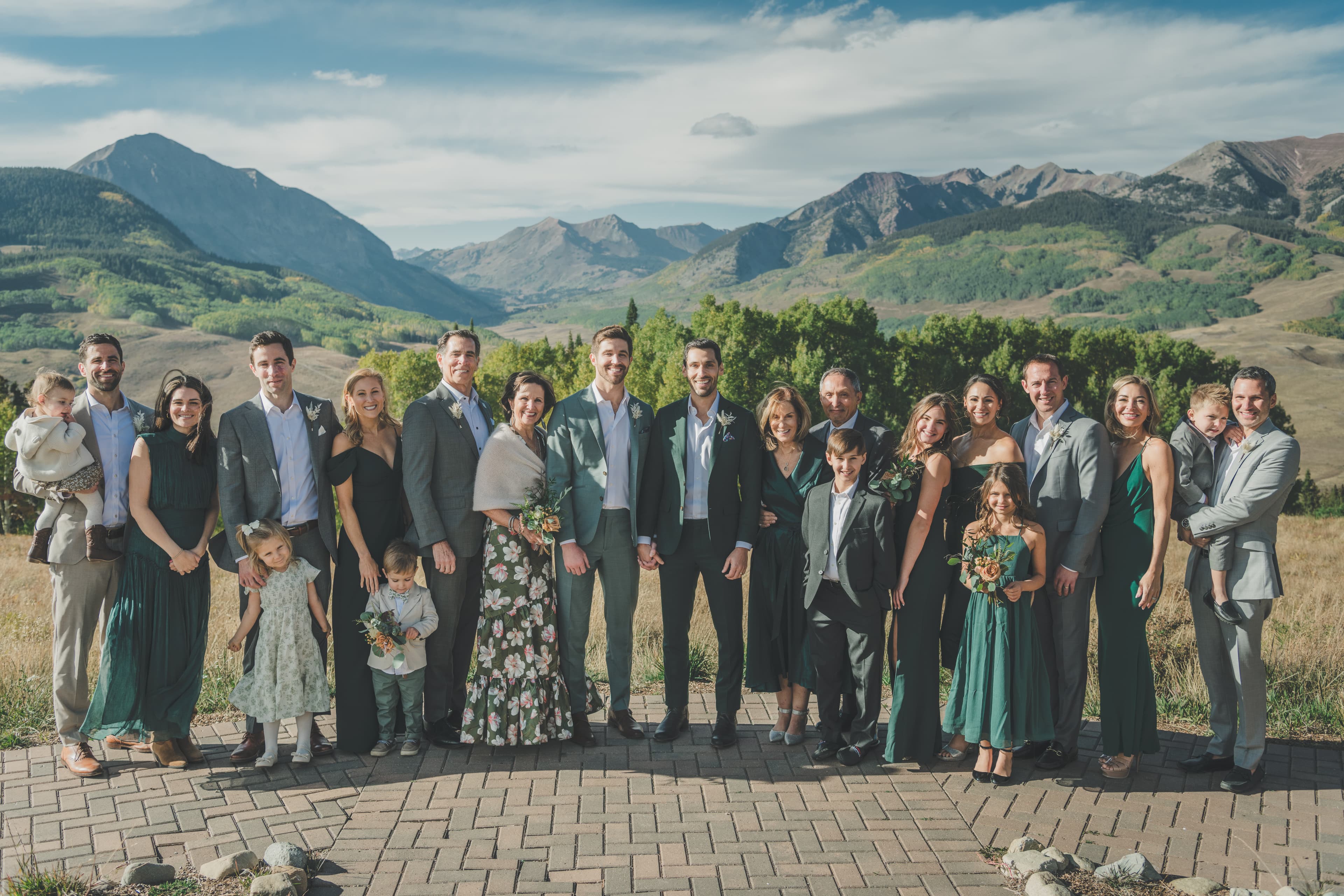 Greg and John with their full family and wedding party, Elk Mountains stretching behind