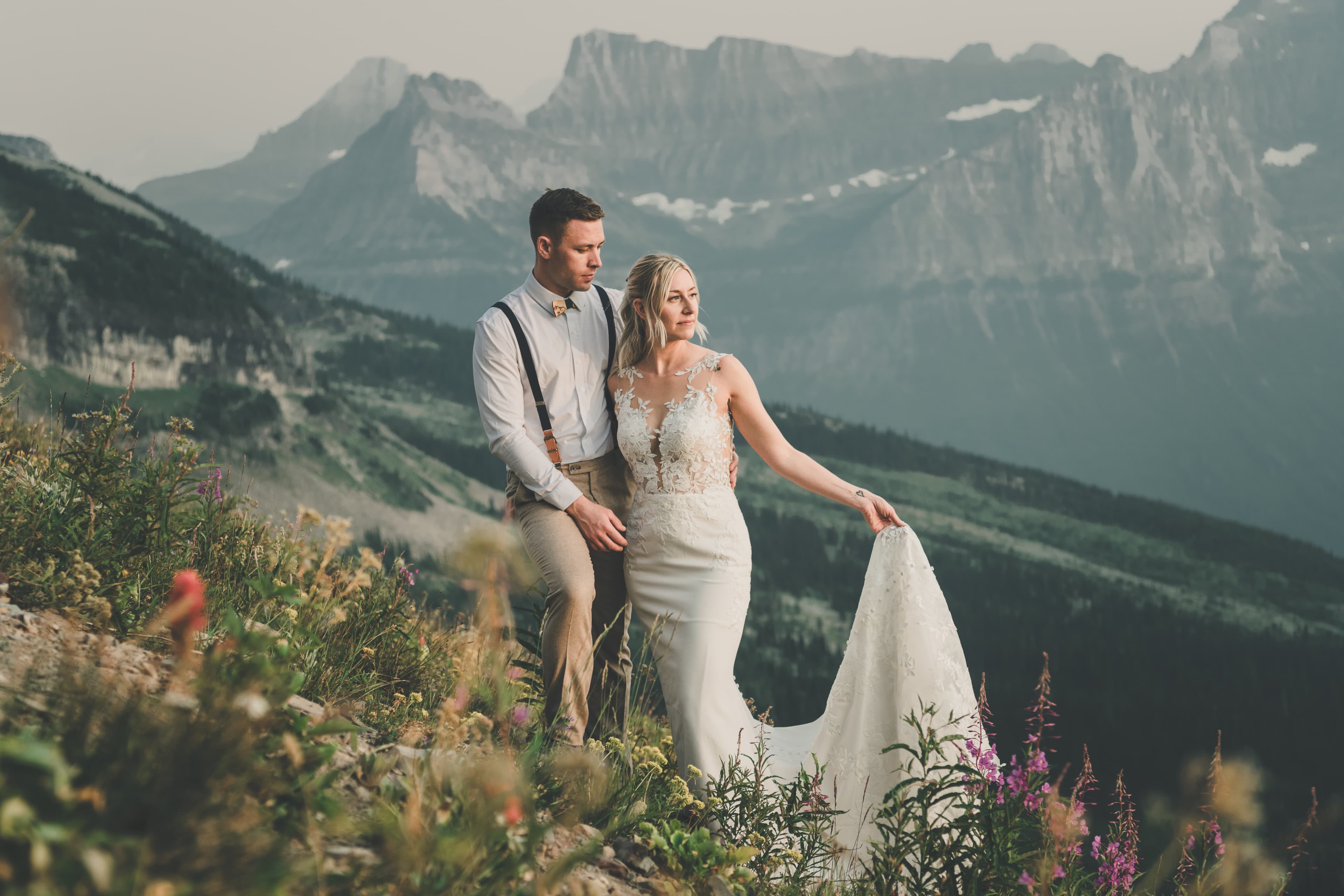 Shawna and Ryan in an alpine wildflower meadow below the Garden Wall, fireweed at their feet