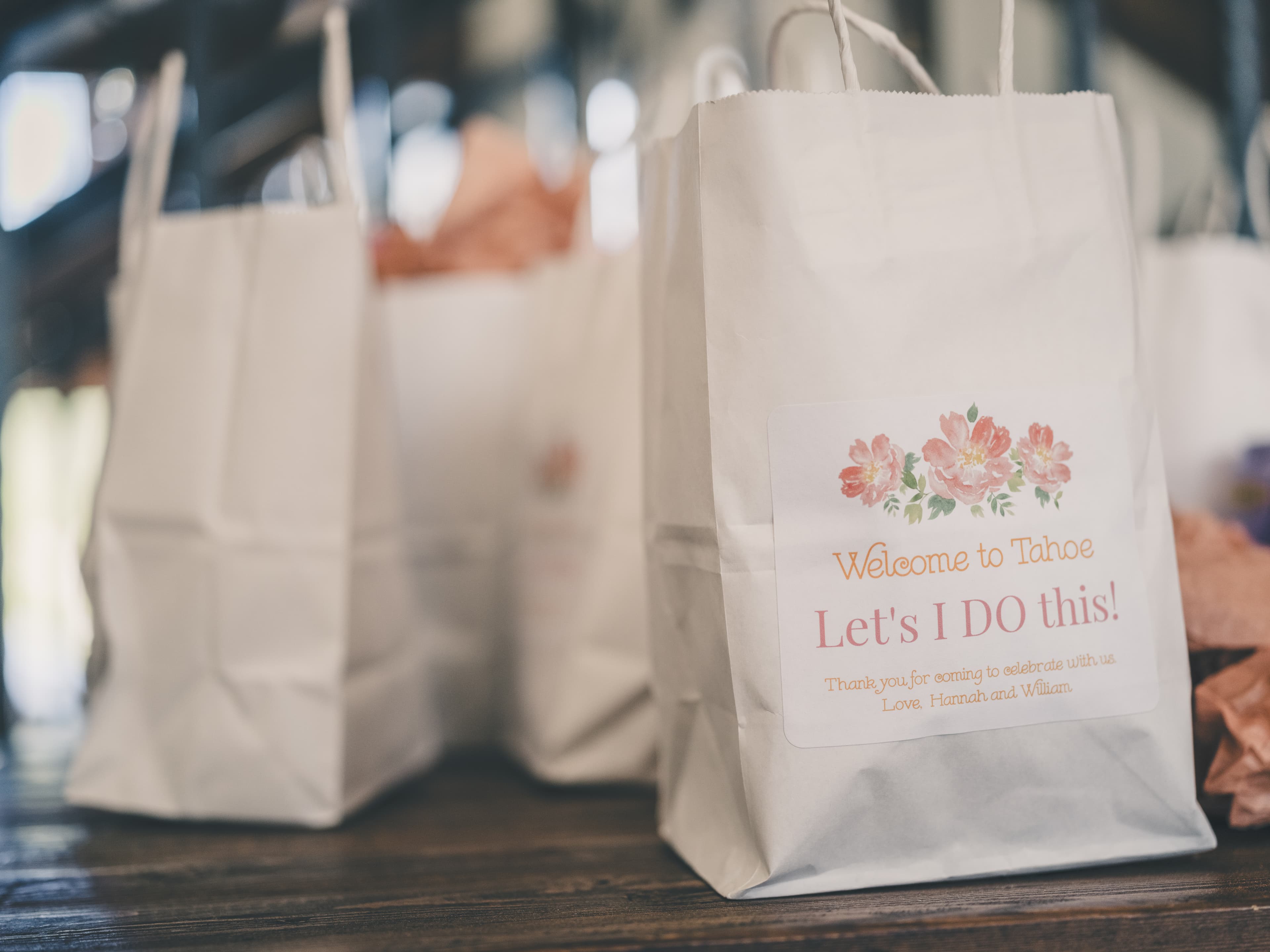 Welcome bag detail reading 'Welcome to Tahoe — Let's I DO this! Love, Hannah and William'