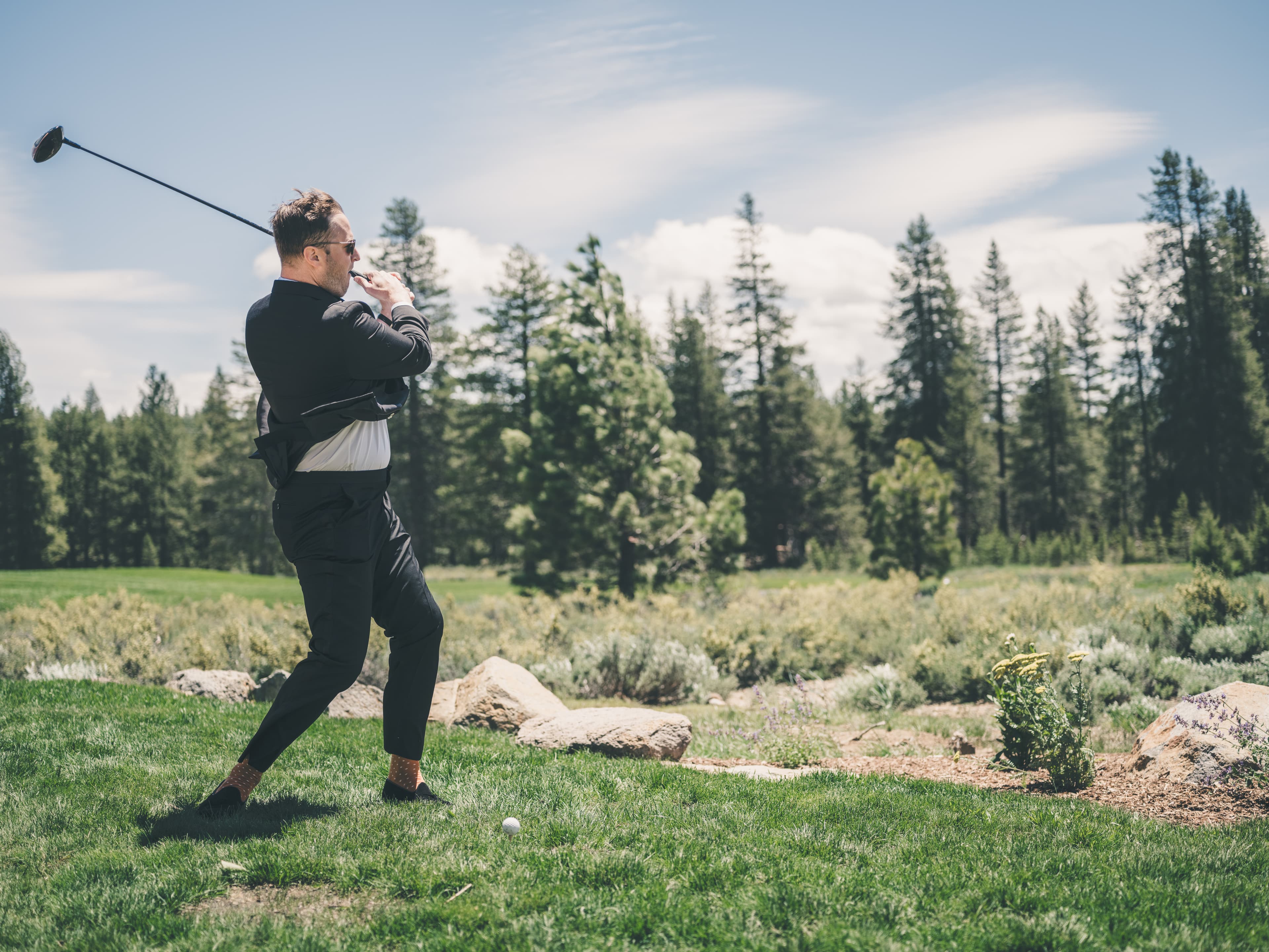 Will mid-swing on the Everline Resort golf course before the ceremony, Sierra pines behind him