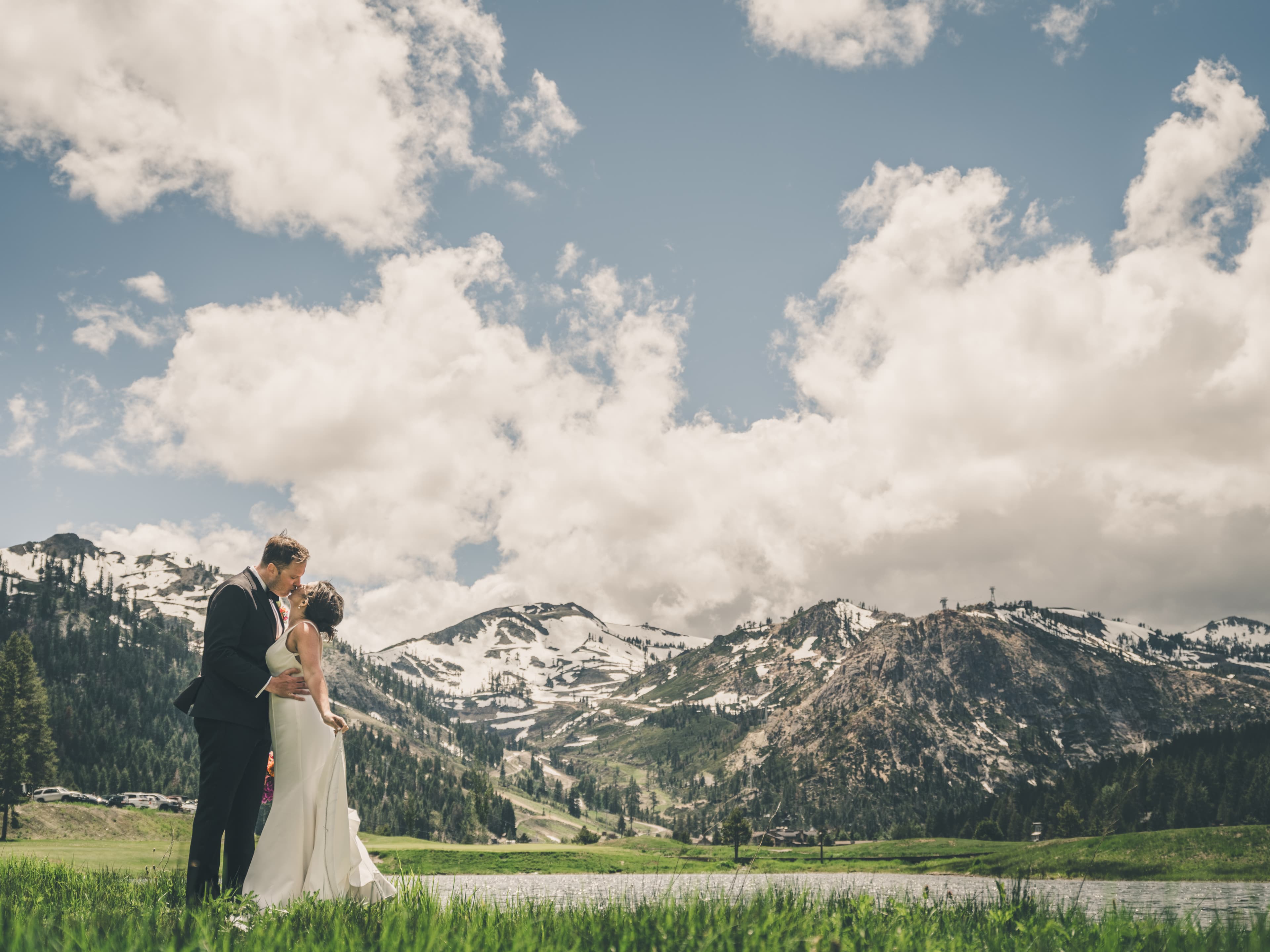 Hannah and Will in the meadow with the Sierra peaks and Olympic Valley stretching behind them