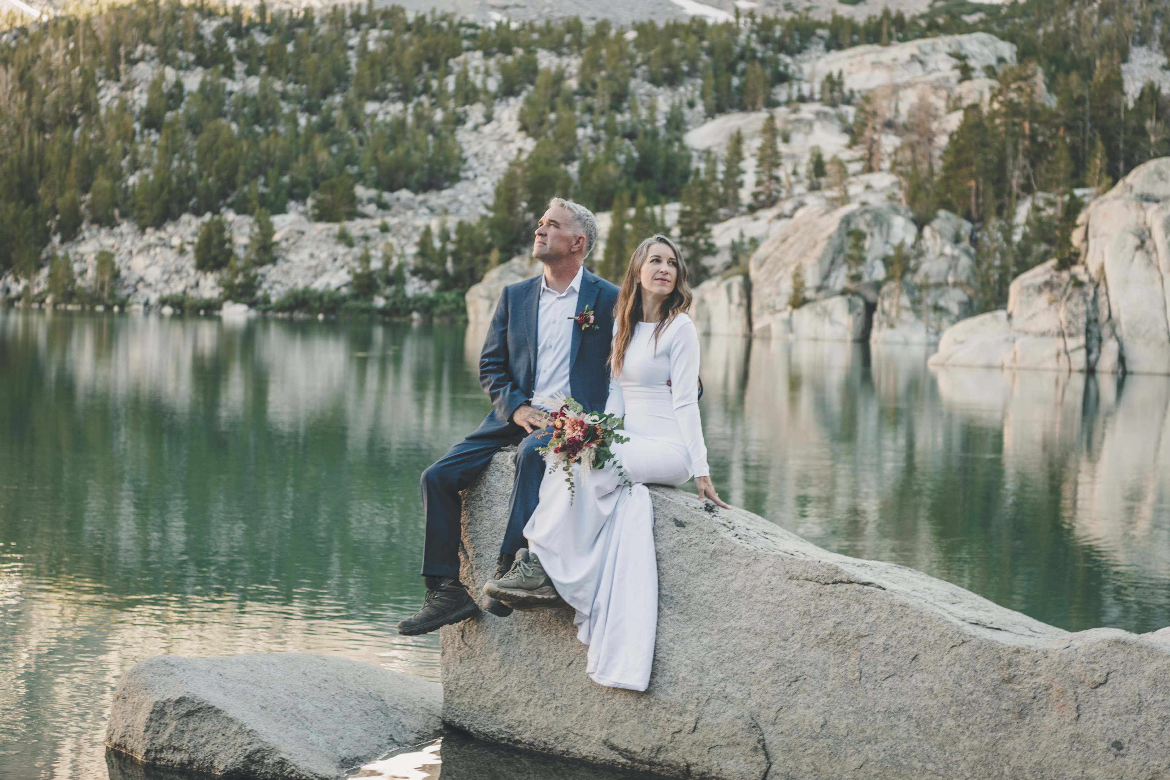 Chrishna and Scott Mammoth elopement — candid moment with mountain scenery