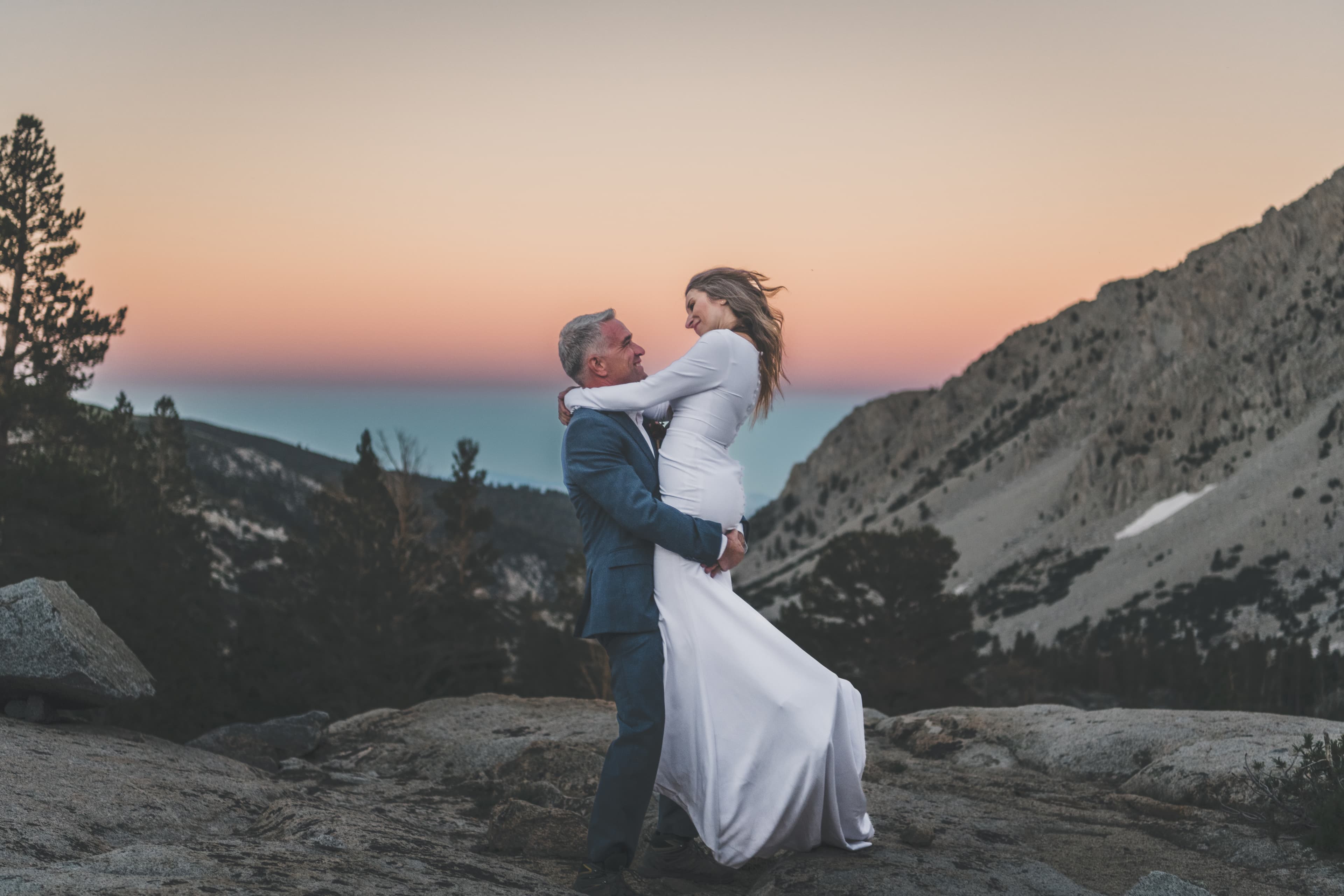 Chrishna and Scott Mammoth elopement — intimate moment with mountain backdrop