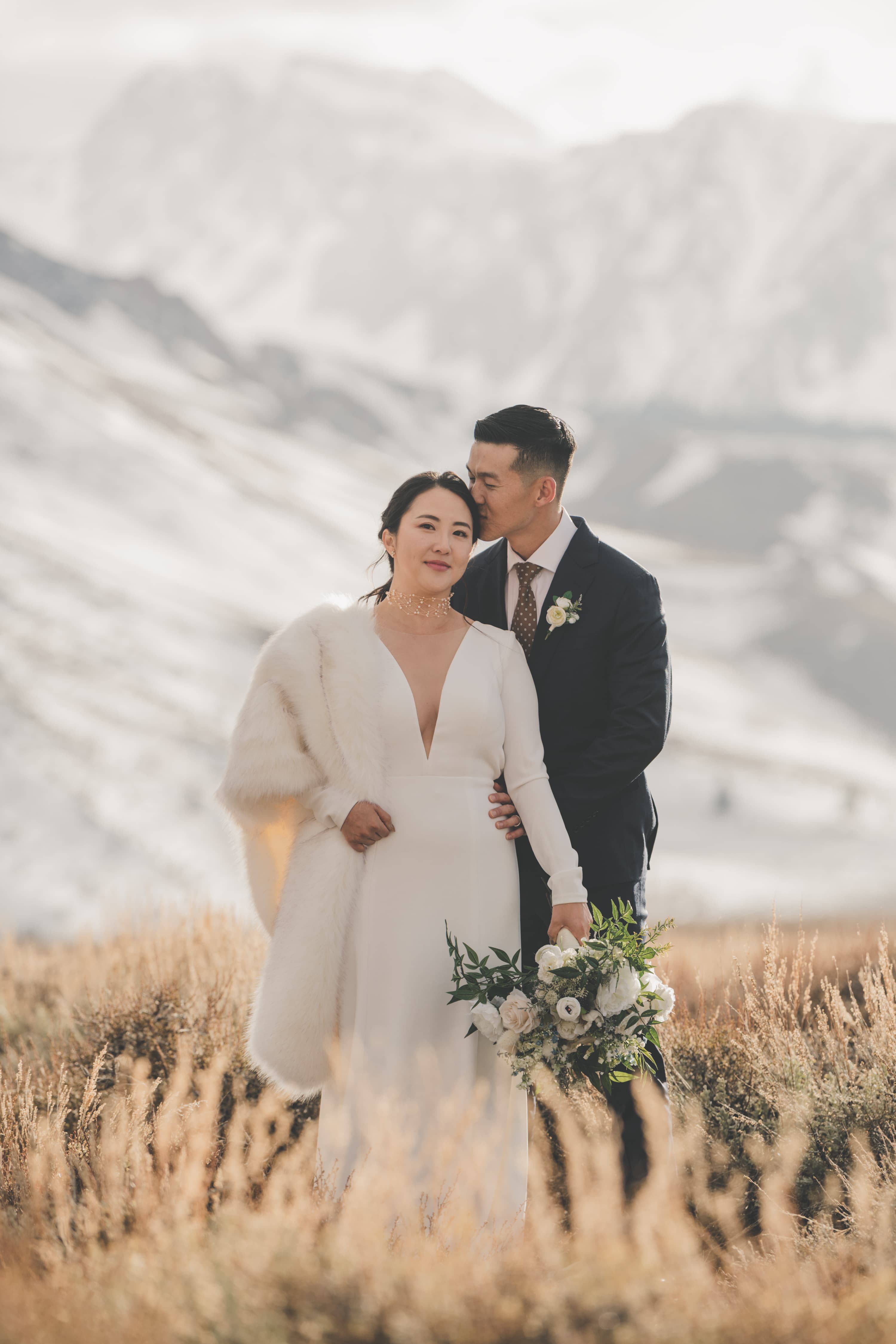 Hana and Chris Mammoth wedding — candid moment with mountain scenery