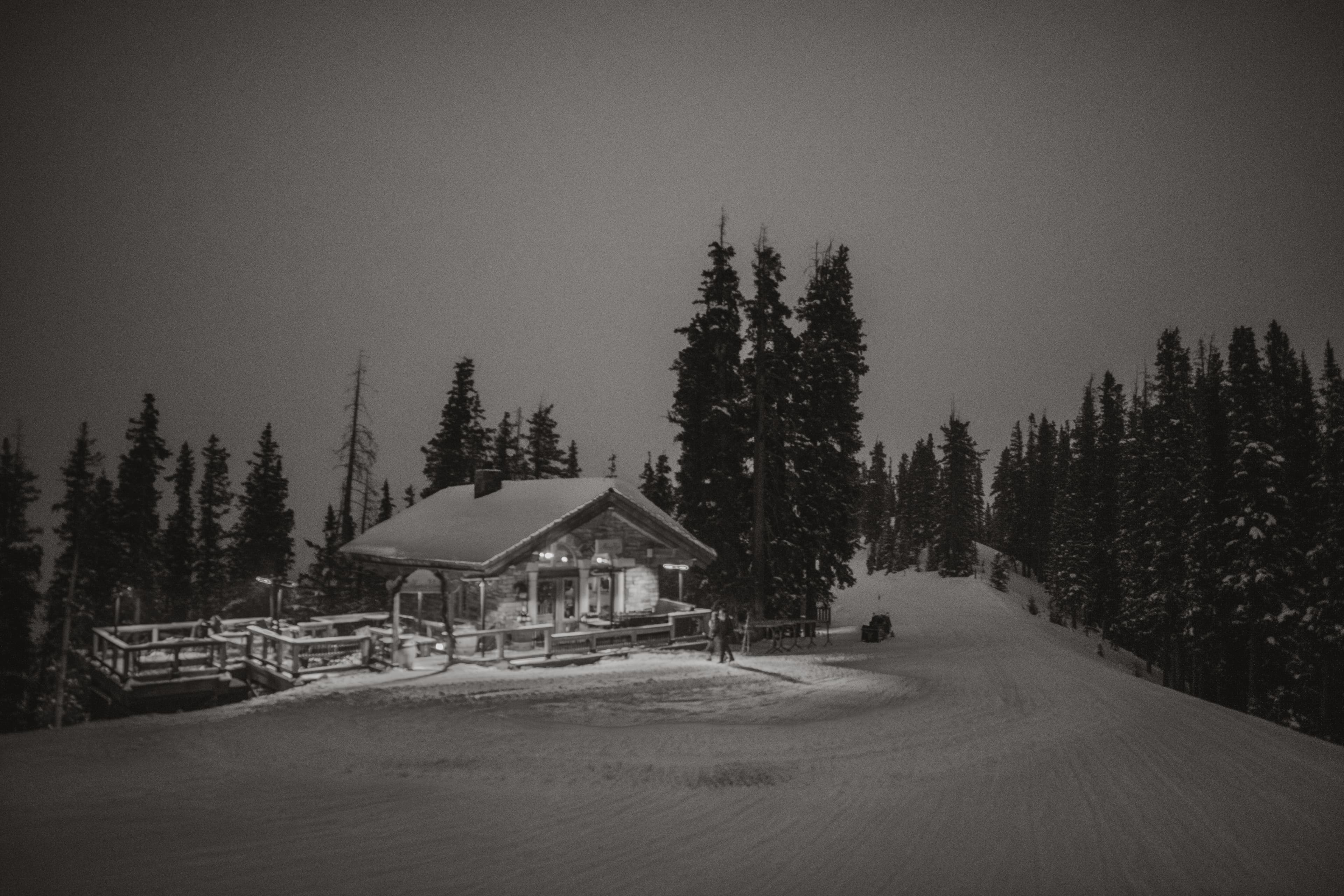 The Alpino Vino stone-and-timber cabin at twilight on the ridge above Telluride Ski Resort