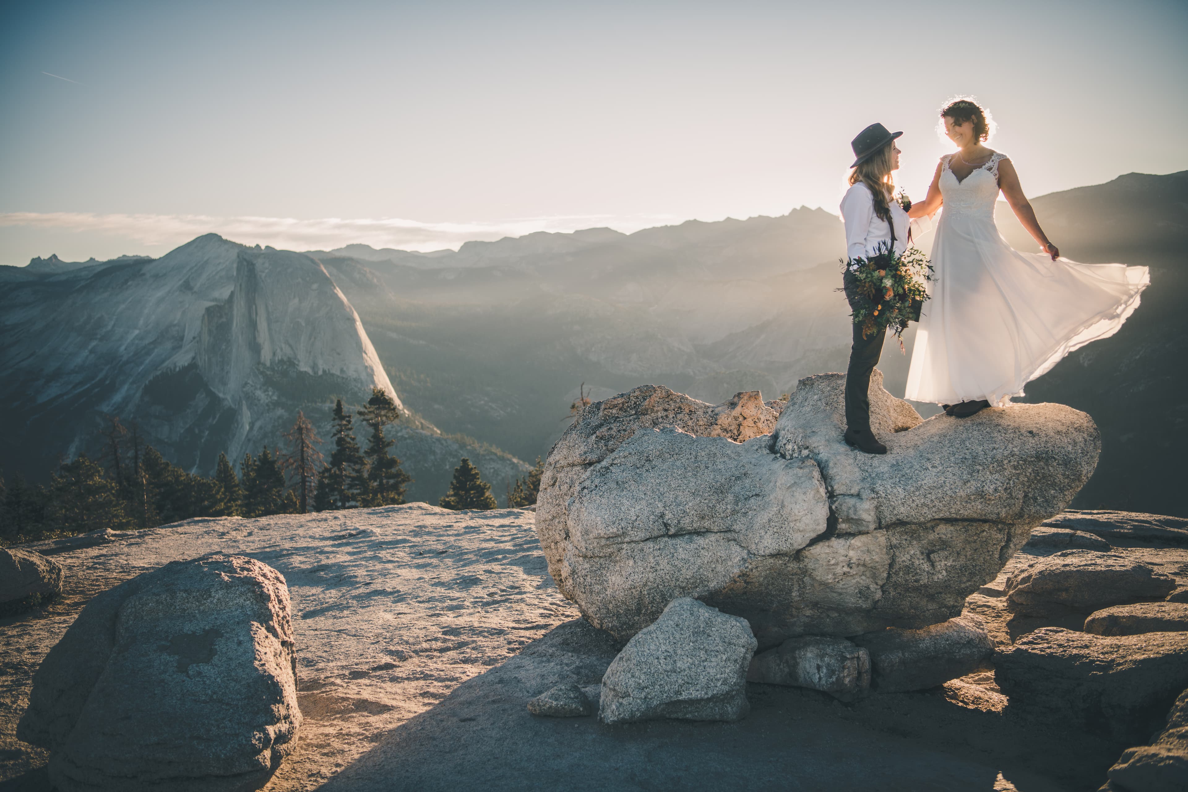 Steph and Katie elopement portrait in Yosemite — golden light on the valley
