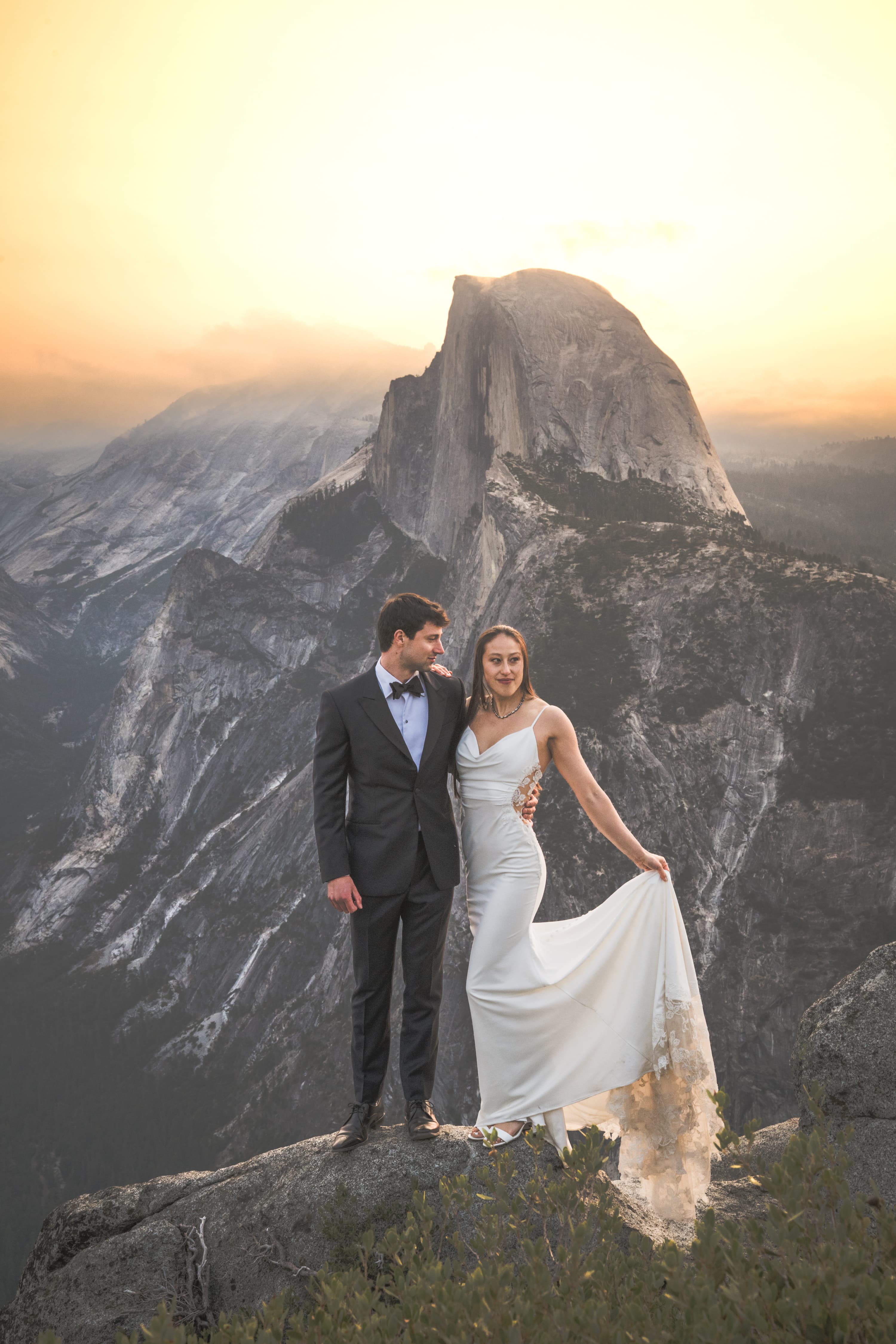 Yuleen and James Yosemite elopement — couple embracing with valley views