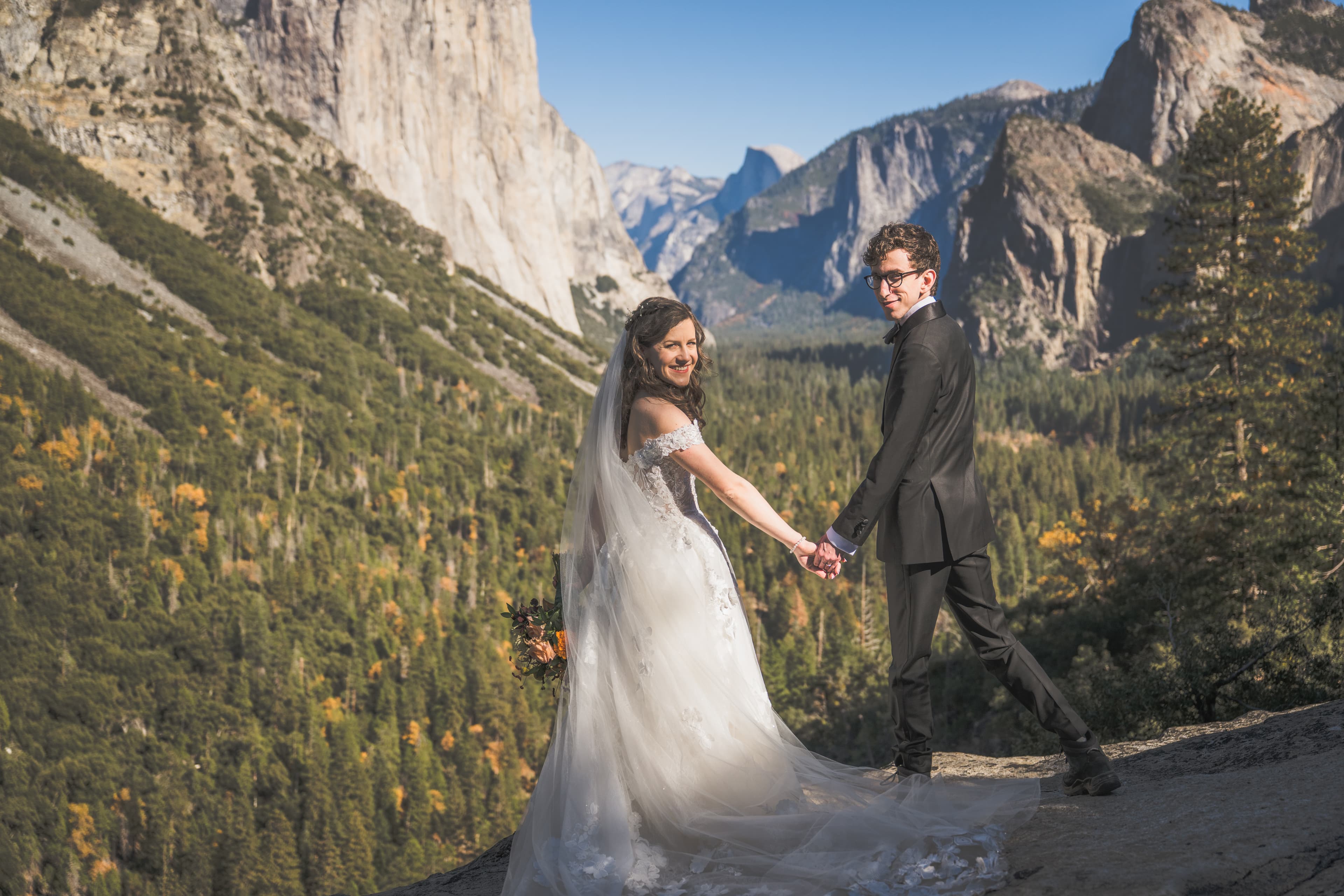 Adam and Steph wedding in Yosemite — couple portrait with granite backdrop