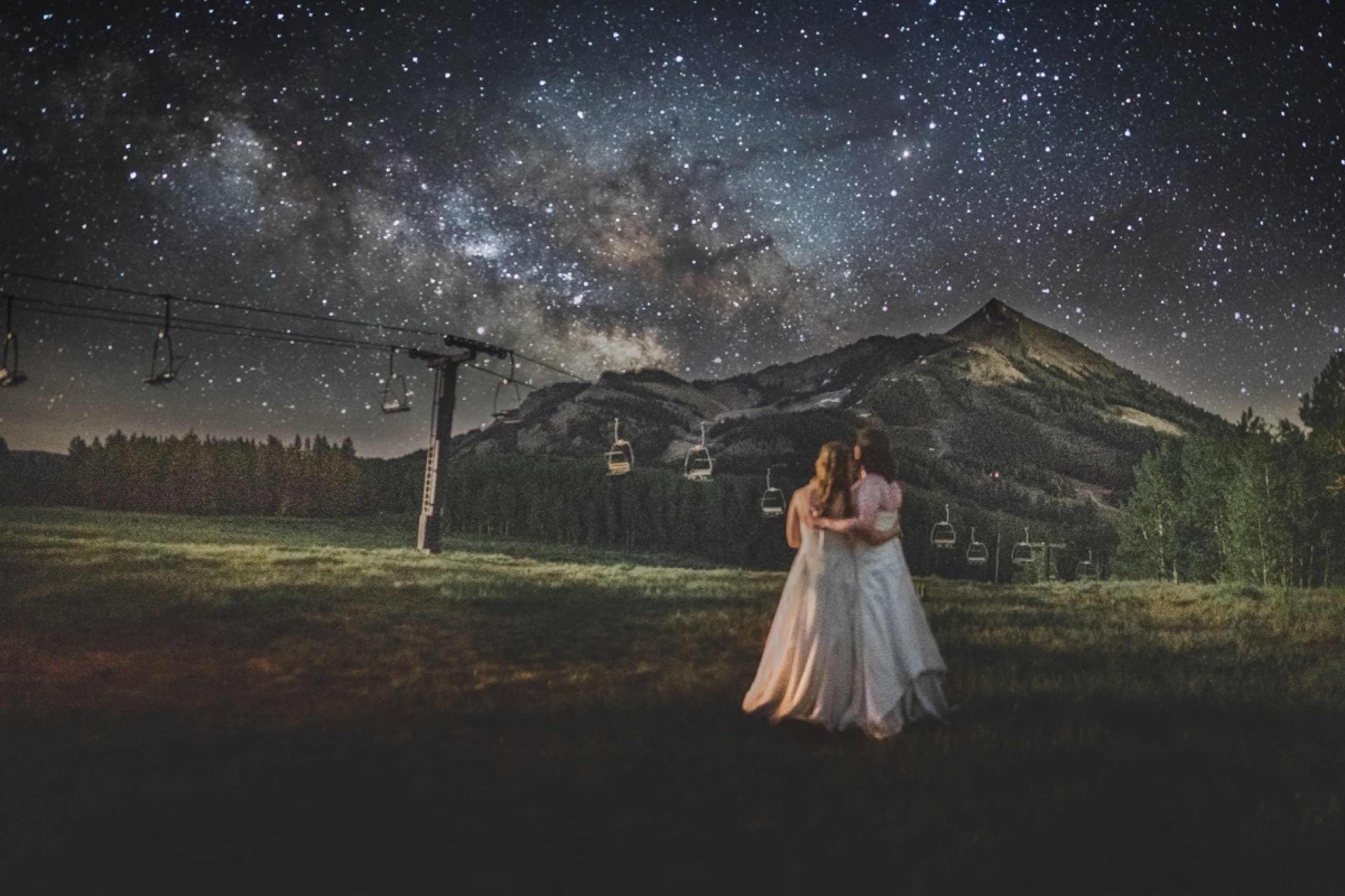 Couple beneath a sky full of stars in the high country