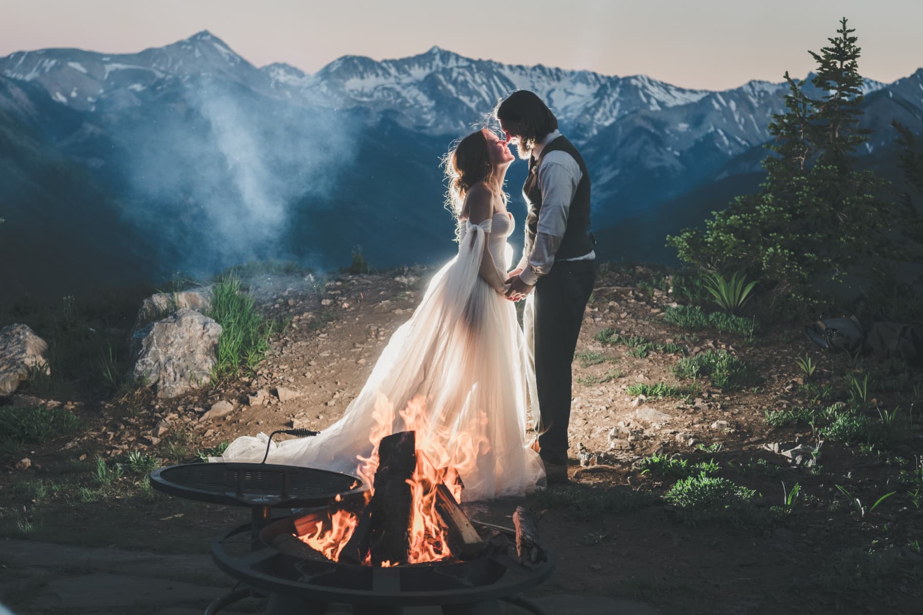Intimate elopement couple at a dramatic mountain overlook at golden hour