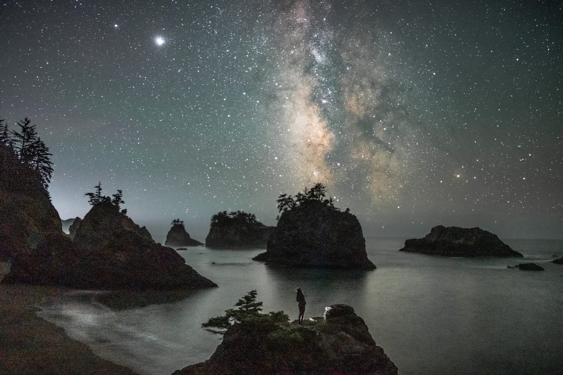 Night sky landscape with Milky Way over mountain peaks